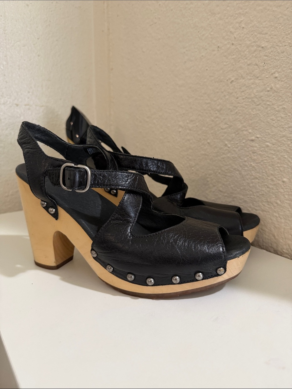 UGG Nadia Clog Sandals on black.